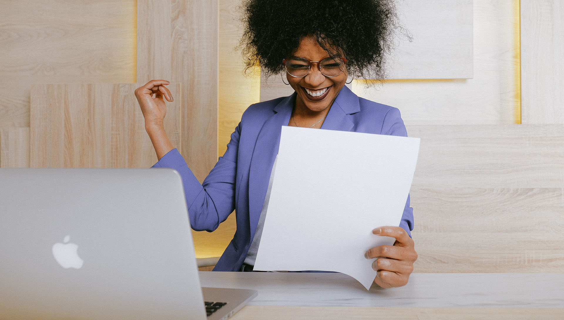 Business woman smiling holding a paper